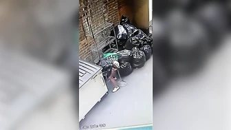 Cctv catches NYC chick pissing by the garbage
