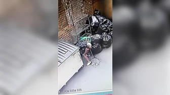 Cctv catches NYC chick pissing by the garbage