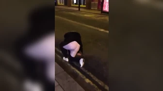 Drunk blonde falls down trying to piss