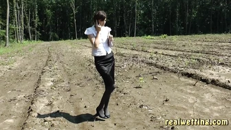 Natalie - The Land Surveyor Natalie Pisses Her Skirt And Pantyhose On The Phone