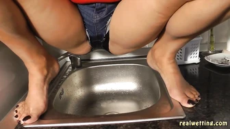 Erica - Erica Pees Her Jeans Shorts Over The Sink